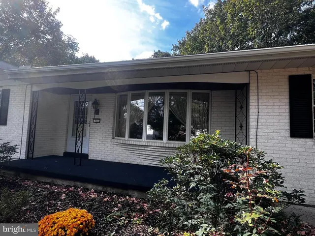 a kitchen with kitchen island granite countertop a sink stainless steel appliances and cabinets