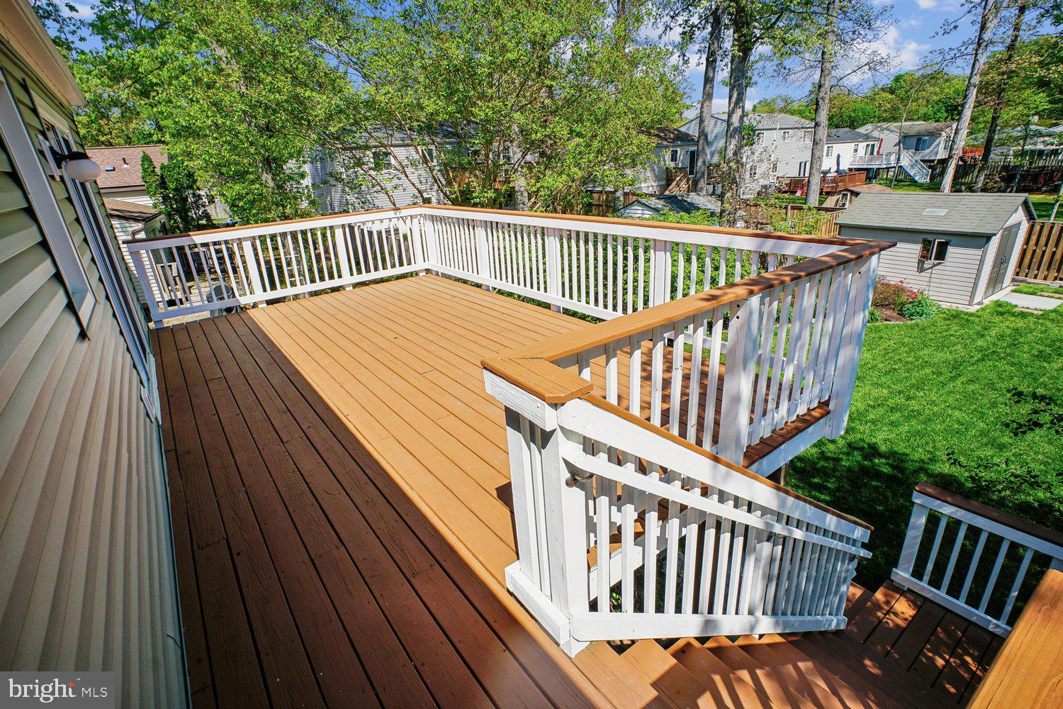 8491 Rippled Creek Court Springfield, VA 22153 - Photo 17 of 40 a view of balcony with wooden deck and outdoor seating
