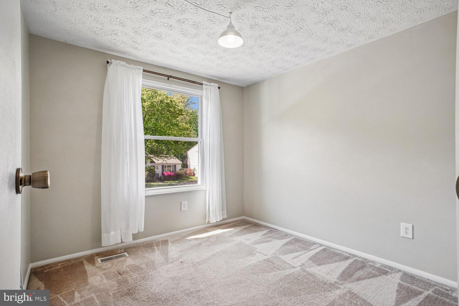 8491 Rippled Creek Court Springfield, VA 22153 - Photo 23 of 40 an empty room with windows