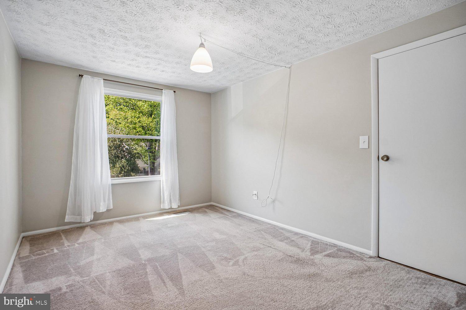 8491 Rippled Creek Court Springfield, VA 22153 - Photo 25 of 40 a view of an empty room with a window