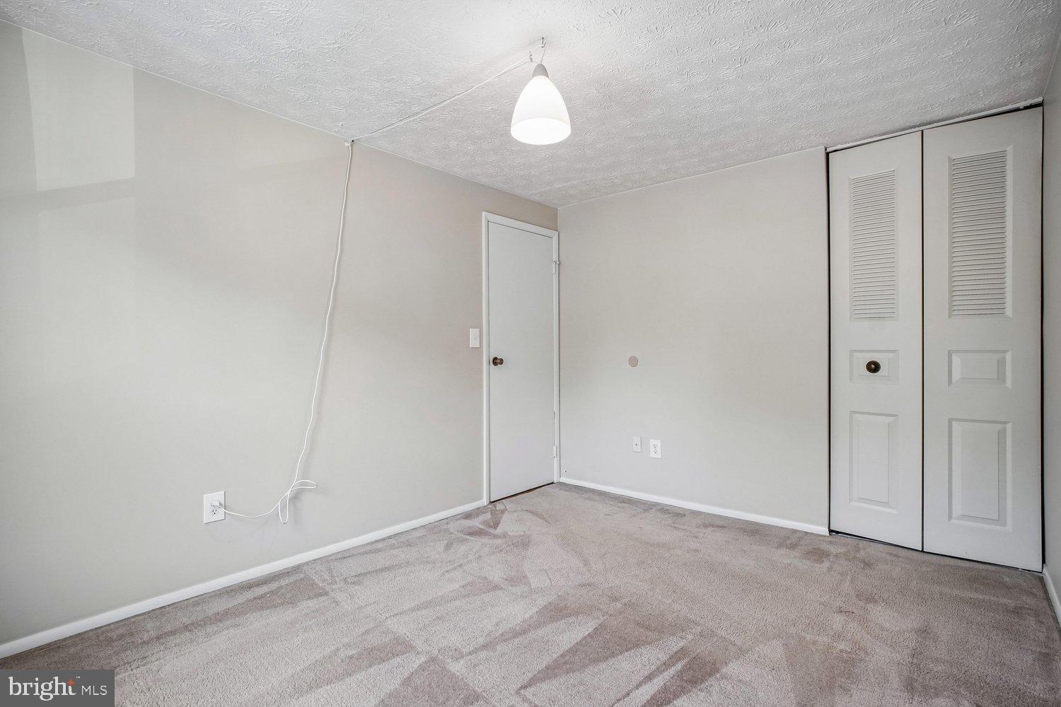 8491 Rippled Creek Court Springfield, VA 22153 - Photo 26 of 40 a view of an empty room and chandelier fan