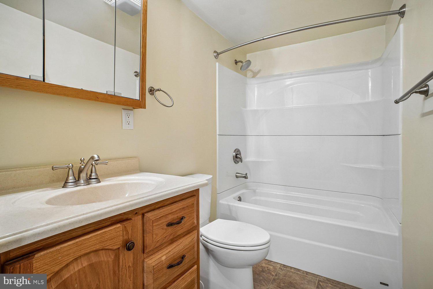 8491 Rippled Creek Court Springfield, VA 22153 - Photo 27 of 40 a bathroom with a sink a toilet and shower