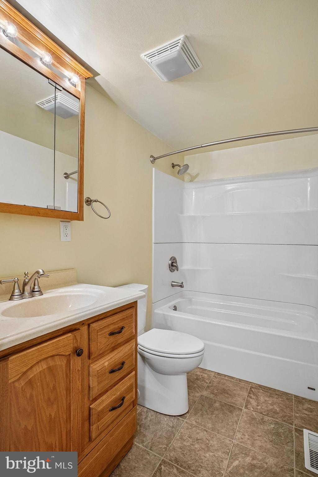 8491 Rippled Creek Court Springfield, VA 22153 - Photo 28 of 40 a bathroom with a sink a toilet and shower