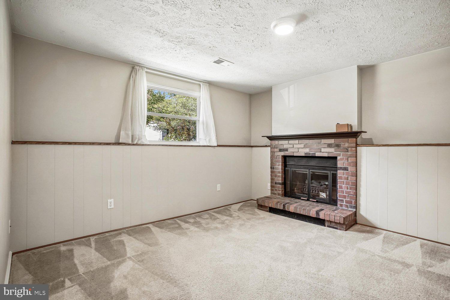 8491 Rippled Creek Court Springfield, VA 22153 - Photo 29 of 40 a view of empty room with a fireplace