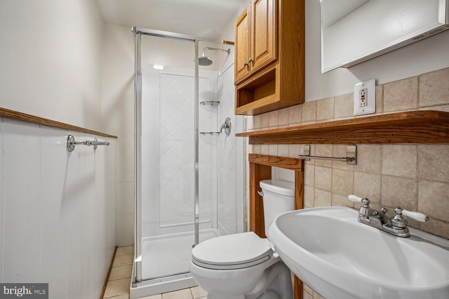 8491 Rippled Creek Court Springfield, VA 22153 - Photo 33 of 40 a bathroom with a sink toilet and shower