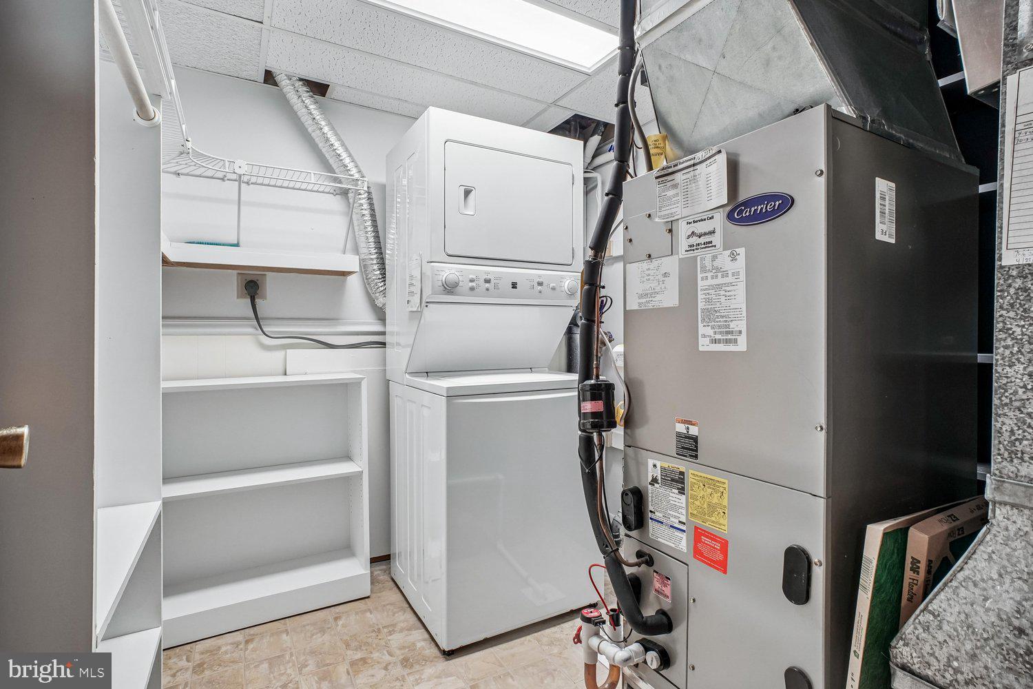 8491 Rippled Creek Court Springfield, VA 22153 - Photo 34 of 40 a utility room with dryer and washer