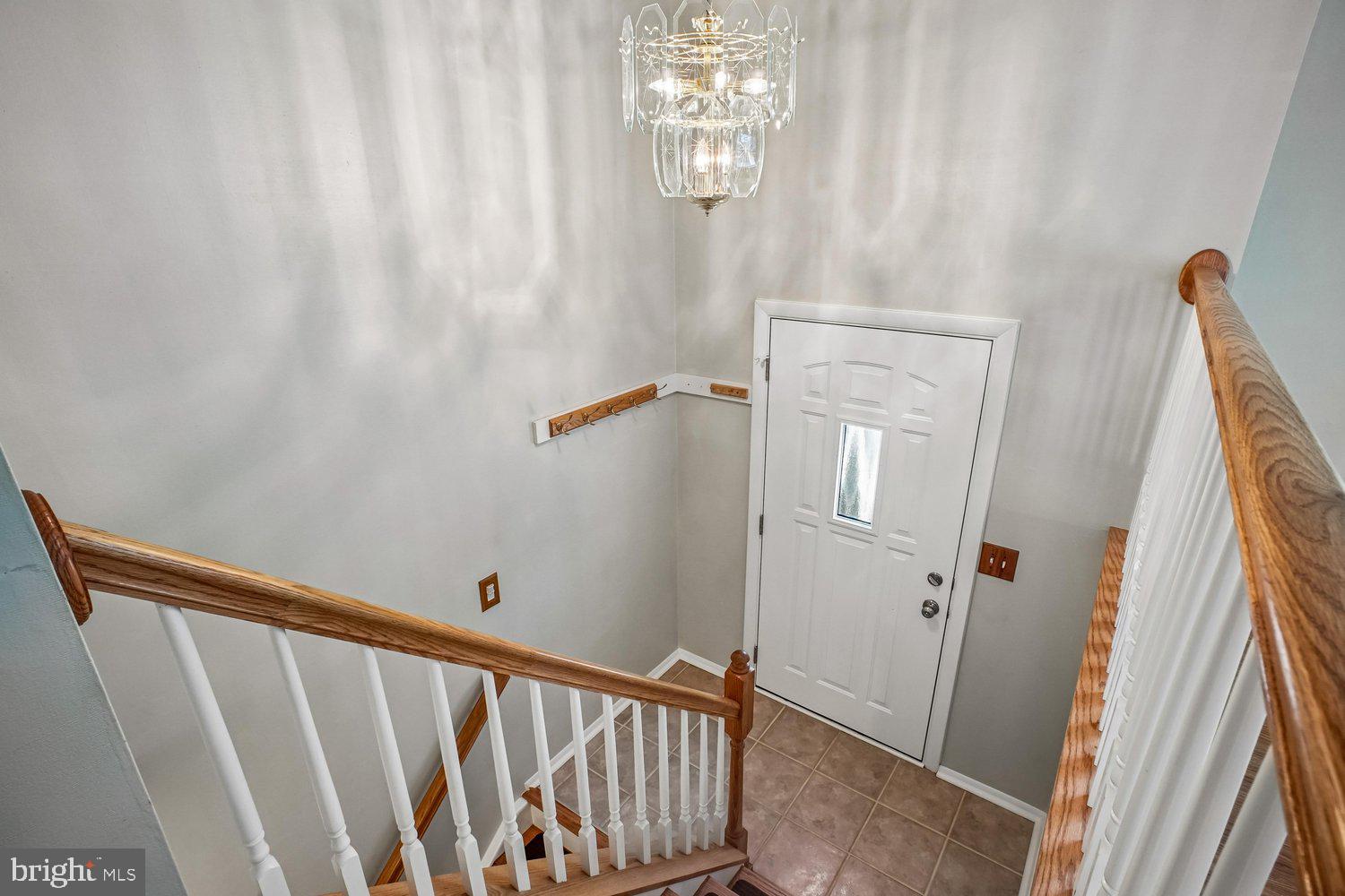 8491 Rippled Creek Court Springfield, VA 22153 - Photo 5 of 40 a view of a hallway with windows