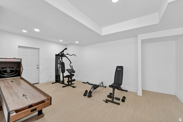572 West 500th Street North Mapleton, UT 84664 - Photo 28 of 46 Exercise room with recessed lighting, light wood-type flooring, and a raised ceiling