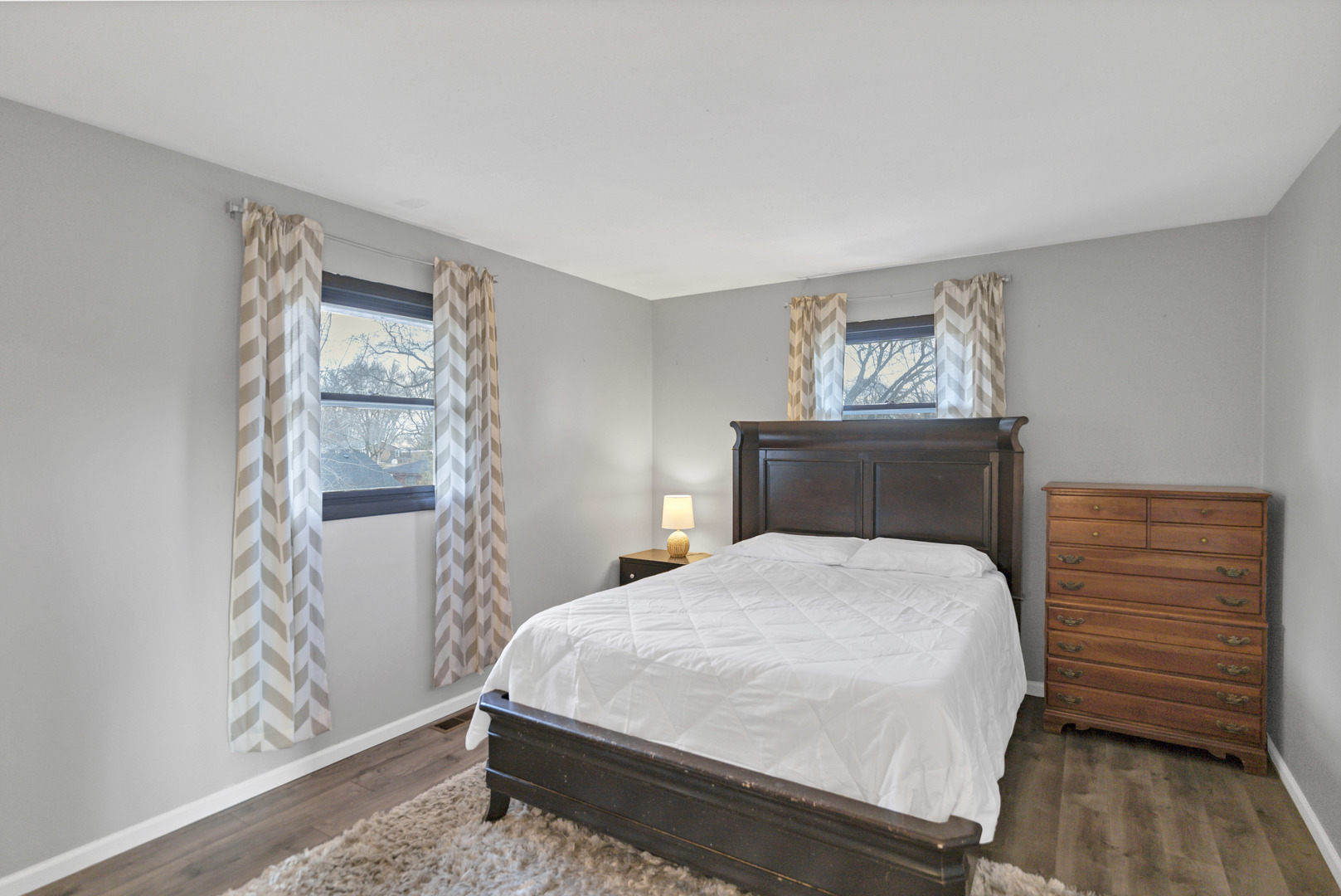 103 Fir Street Lake In The Hills, IL 60156 - Photo 11 of 31 a bedroom with a bed and wooden floor