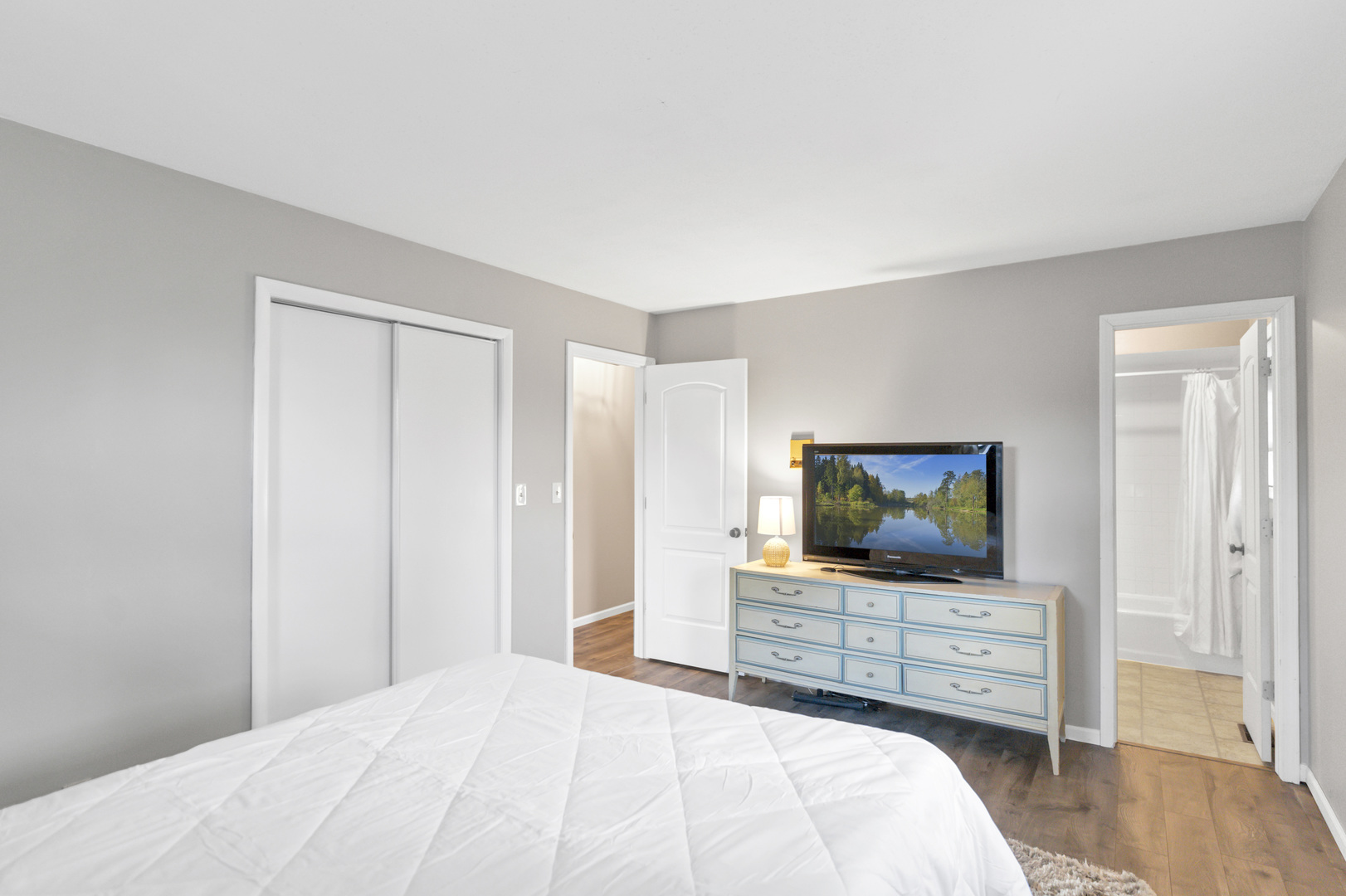 103 Fir Street Lake In The Hills, IL 60156 - Photo 12 of 31 a bedroom with a bed and a flat screen tv