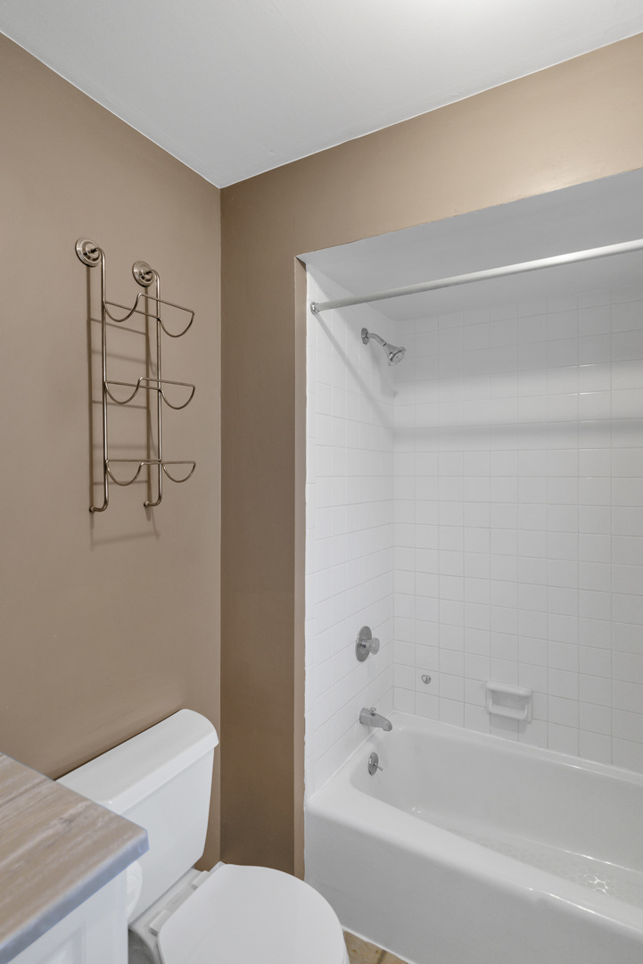 103 Fir Street Lake In The Hills, IL 60156 - Photo 13 of 31 a bathroom with a toilet and a bathtub
