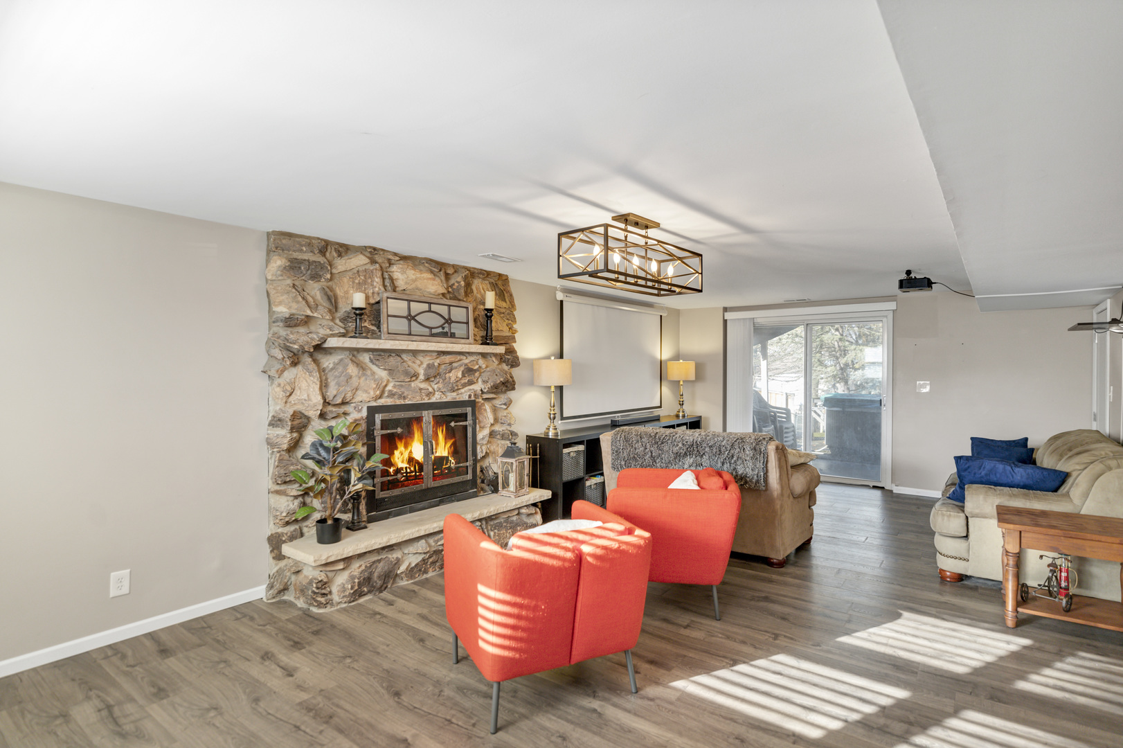 103 Fir Street Lake In The Hills, IL 60156 - Photo 20 of 31 a living room with furniture a fireplace and a flat screen tv