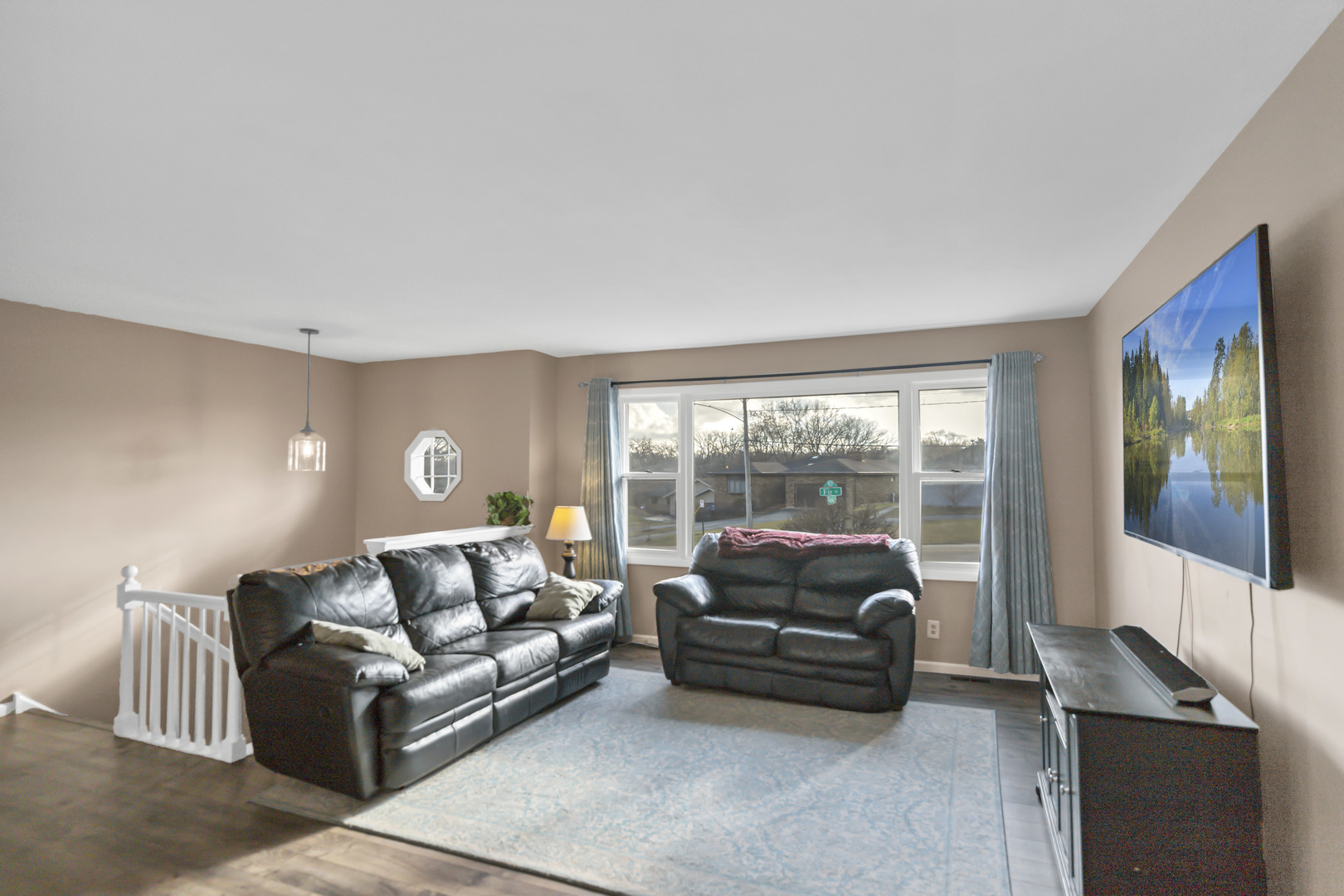 103 Fir Street Lake In The Hills, IL 60156 - Photo 3 of 31 a living room with furniture and a large window