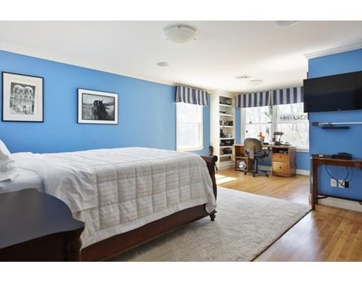 7 Deer Run Road Lincoln, MA 01773 - Photo 20 of 30 a bedroom with a large bed and a flat tv screen on dresser