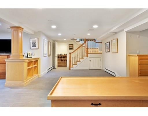 7 Deer Run Road Lincoln, MA 01773 - Photo 25 of 30 a living room with stainless steel appliances kitchen island a stove a refrigerator cabinets and wooden floor