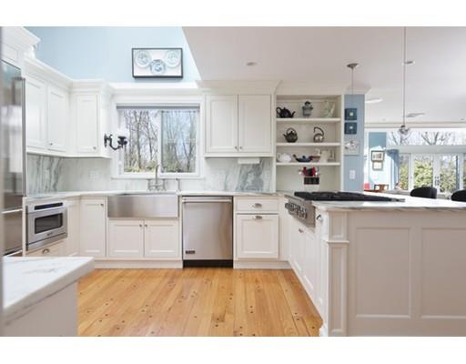 7 Deer Run Road Lincoln, MA 01773 - Photo 5 of 30 a kitchen with stainless steel appliances kitchen island granite countertop a sink cabinets and wooden floor