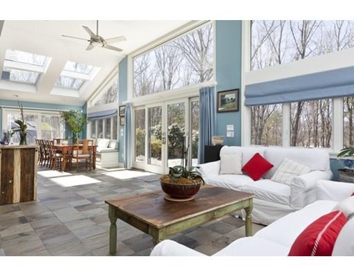 7 Deer Run Road Lincoln, MA 01773 - Photo 8 of 30 a living room with furniture a chandelier and a large window