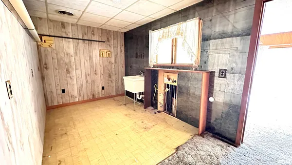 a bed room with a bed and a window