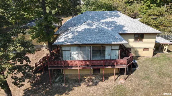 a view of a house with roof deck front of house