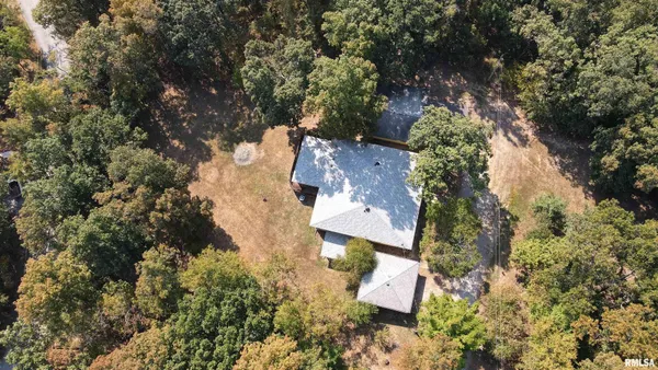 an aerial view of residential house with outdoor space