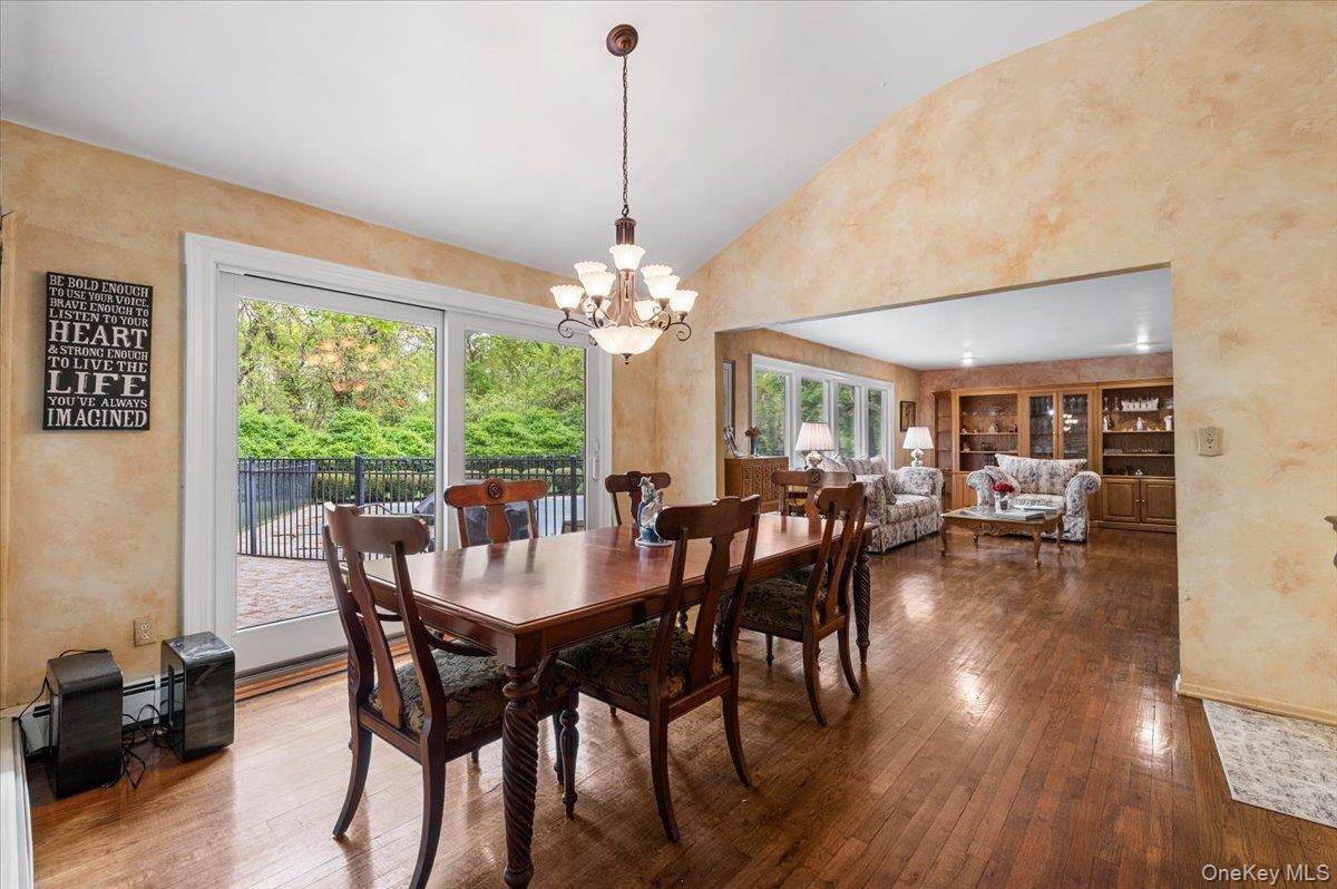 6 Apex Road Melville, NY 11747 - Photo 8 of 50 a view of a dining room with furniture window and wooden floor