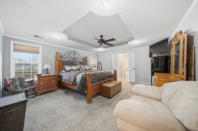 a bed room with a bed and a couch