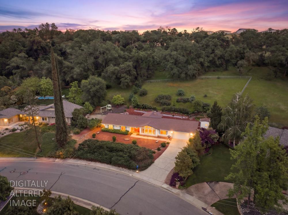 4071 Silver Street Rocklin, CA 95677 - Photo 2 of 70 a view of a lake in middle of the forest