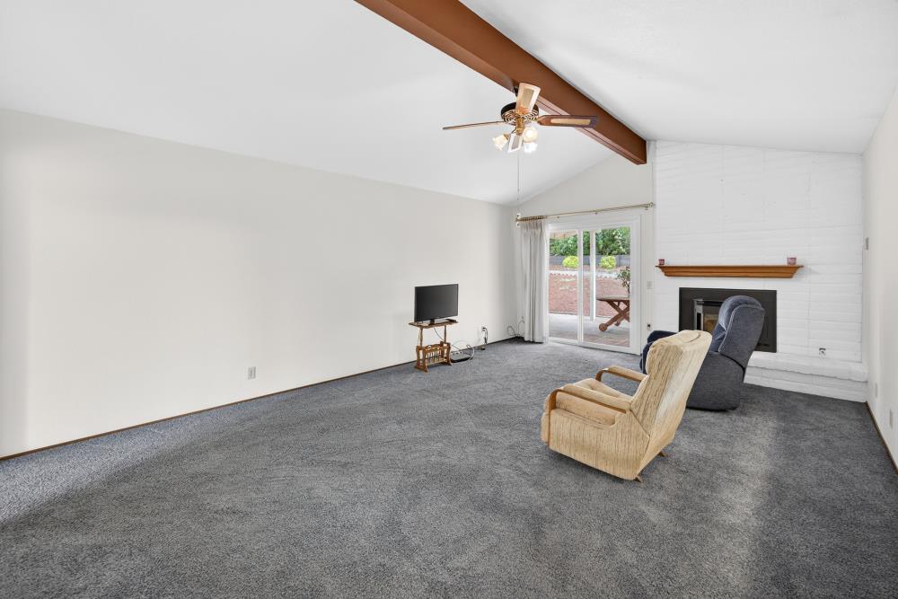 4071 Silver Street Rocklin, CA 95677 - Photo 23 of 70 a living room with furniture and a fireplace
