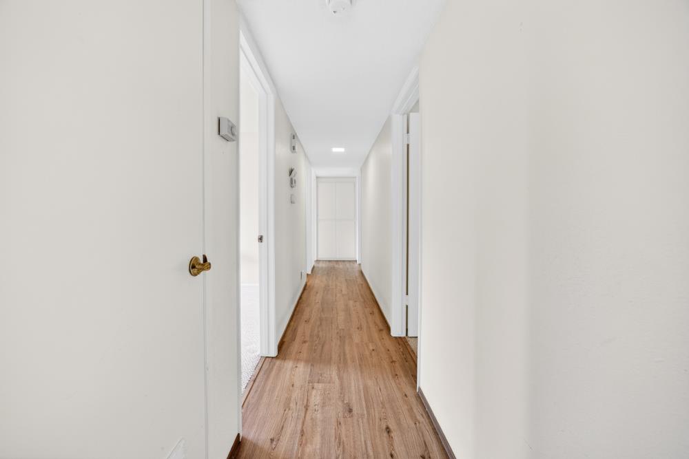 4071 Silver Street Rocklin, CA 95677 - Photo 24 of 70 a view of a hallway with wooden floor and closet