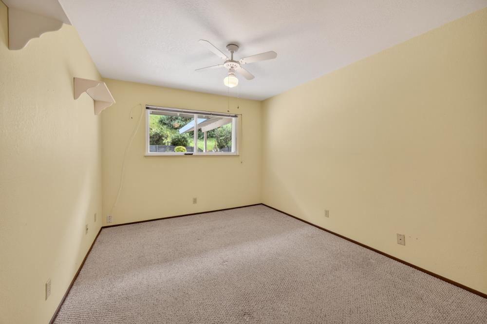 4071 Silver Street Rocklin, CA 95677 - Photo 31 of 70 an empty room with a window and a ceiling fan