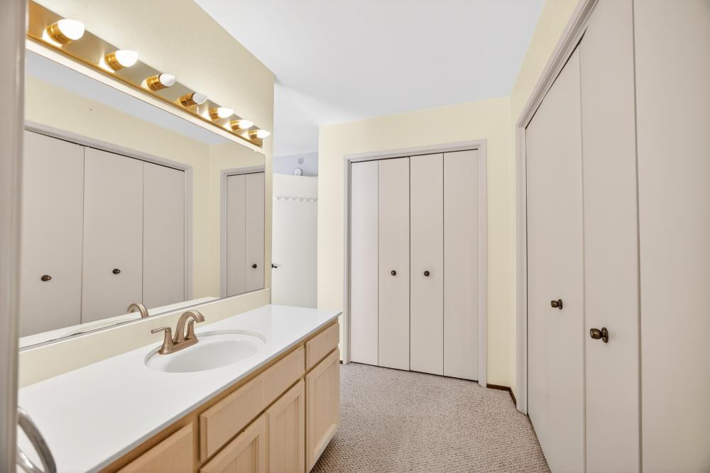 4071 Silver Street Rocklin, CA 95677 - Photo 35 of 70 a bathroom with a double vanity sink and a mirror