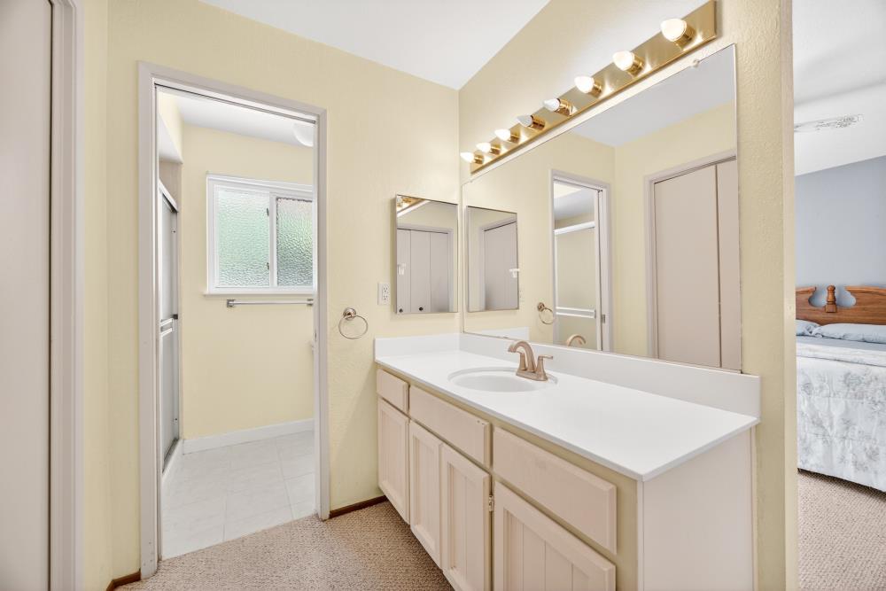 4071 Silver Street Rocklin, CA 95677 - Photo 36 of 70 a bathroom with a sink a mirror and a shower