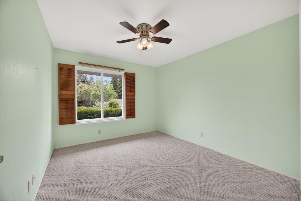 4071 Silver Street Rocklin, CA 95677 - Photo 37 of 70 an empty room with a window and a ceiling fan