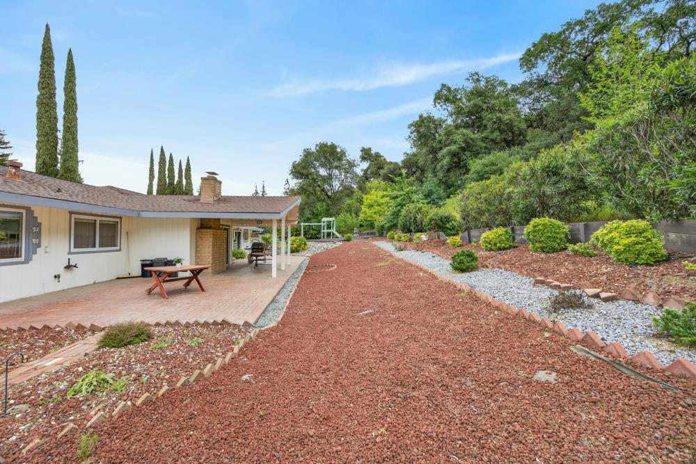 4071 Silver Street Rocklin, CA 95677 - Photo 48 of 70 a front view of a house with a garden and patio