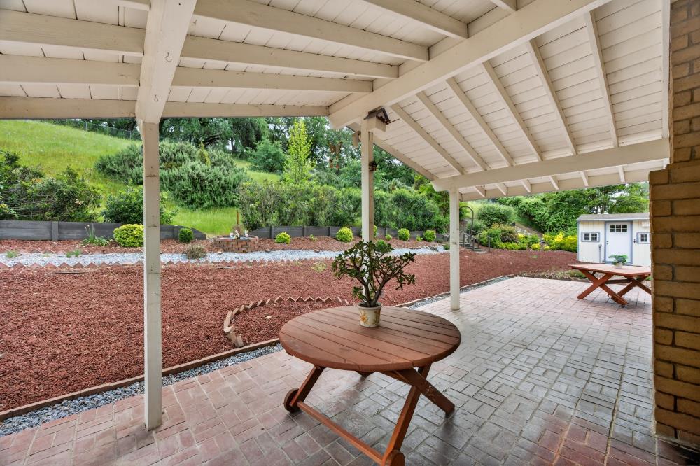 4071 Silver Street Rocklin, CA 95677 - Photo 52 of 70 a view of a patio with a table chairs and a backyard