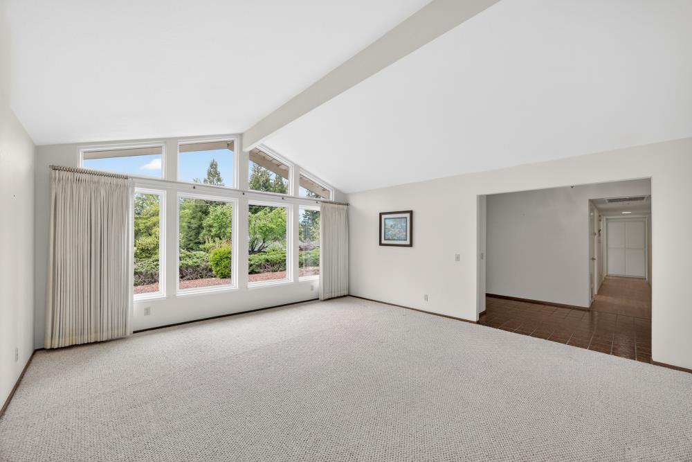4071 Silver Street Rocklin, CA 95677 - Photo 8 of 70 a view of a big room with windows and chandelier fan