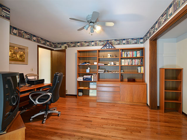 587 Scots Court Inverness, IL 60067 - Photo 6 of 18 a view of a workspace with furniture and wooden floor