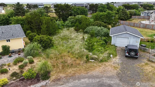 an aerial view of a house with a yard and garage