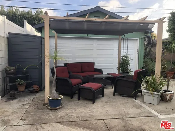 a view of a potted plants next to a yard