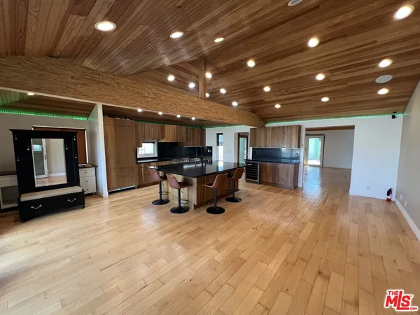a view of a room with chairs and closet
