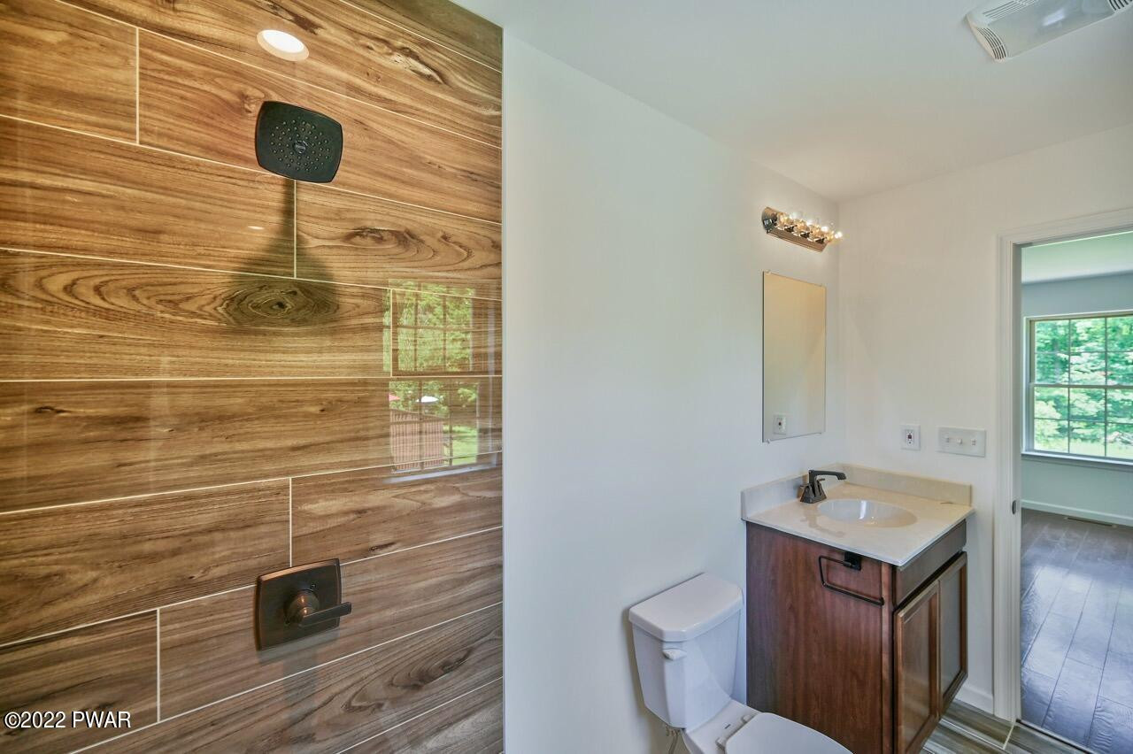 45 Rockway Road Lake Ariel, PA 18436 - Photo 36 of 65 a bathroom with a sink and a mirror