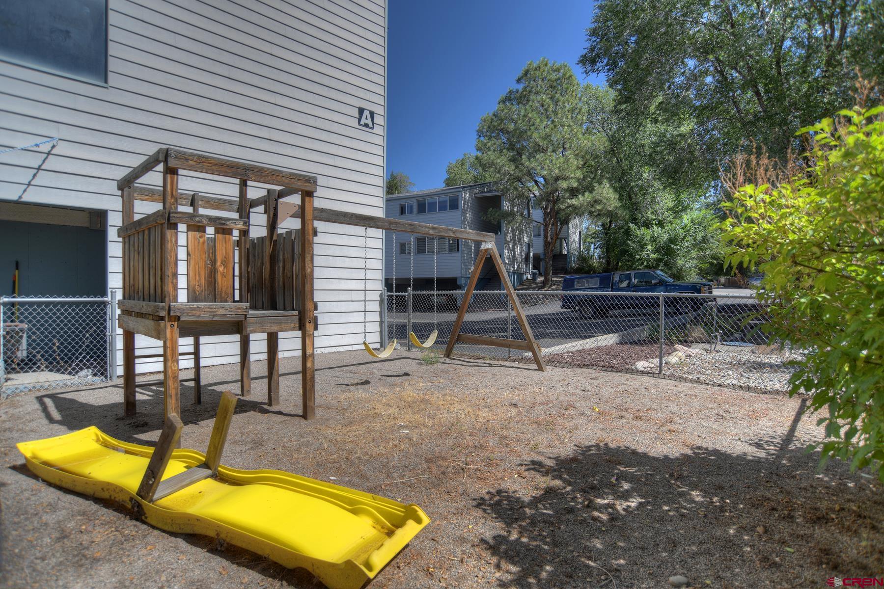 1135 Florida Road, Unit C27 Durango, CO 81301 - Photo 16 of 16 a view of a house with backyard and furniture