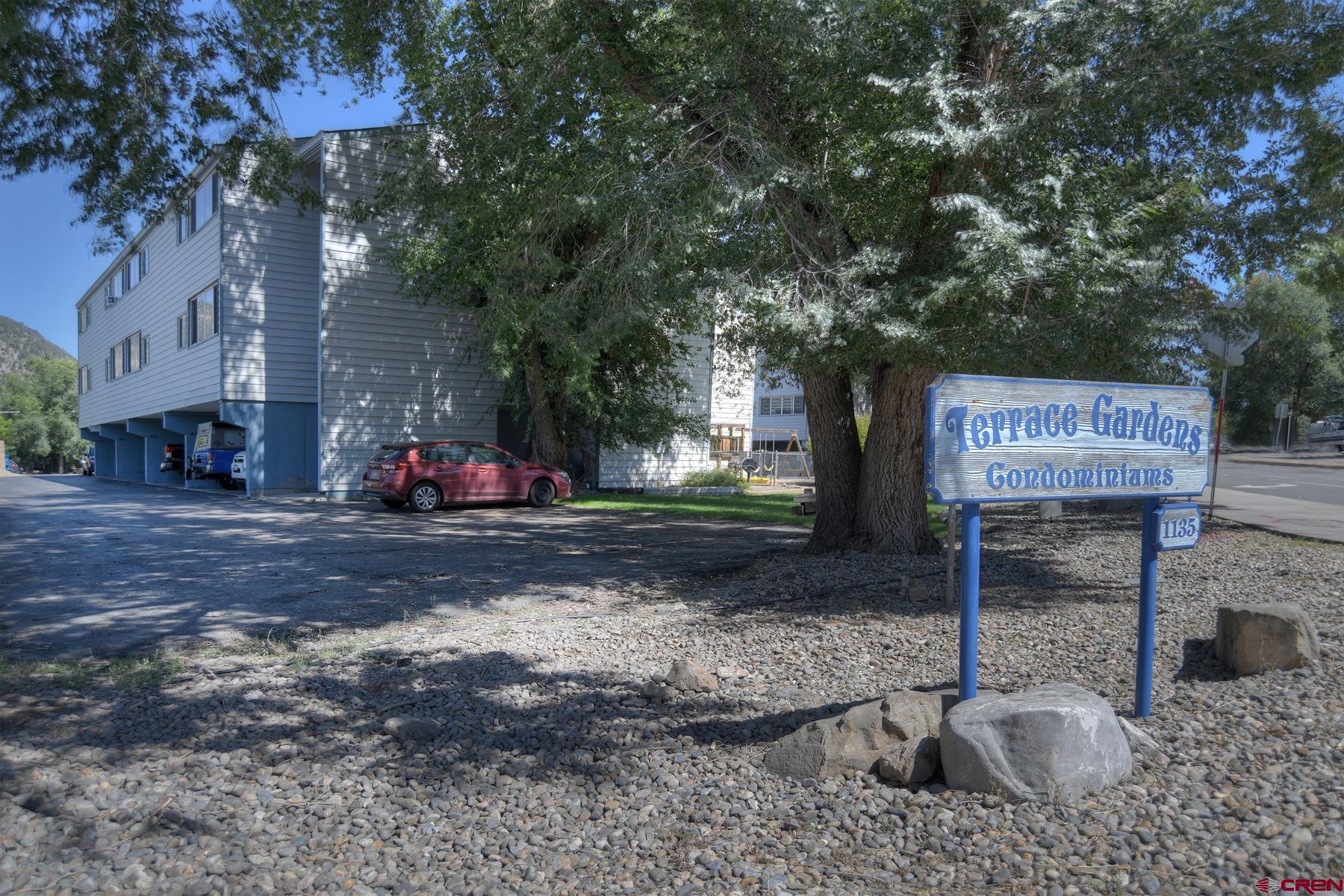 1135 Florida Road, Unit C27 Durango, CO 81301 - Photo 2 of 16 a front view of a house with garden