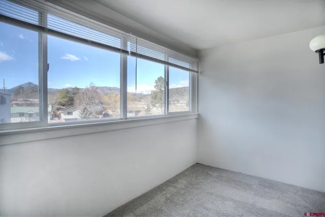 an empty room with a large window