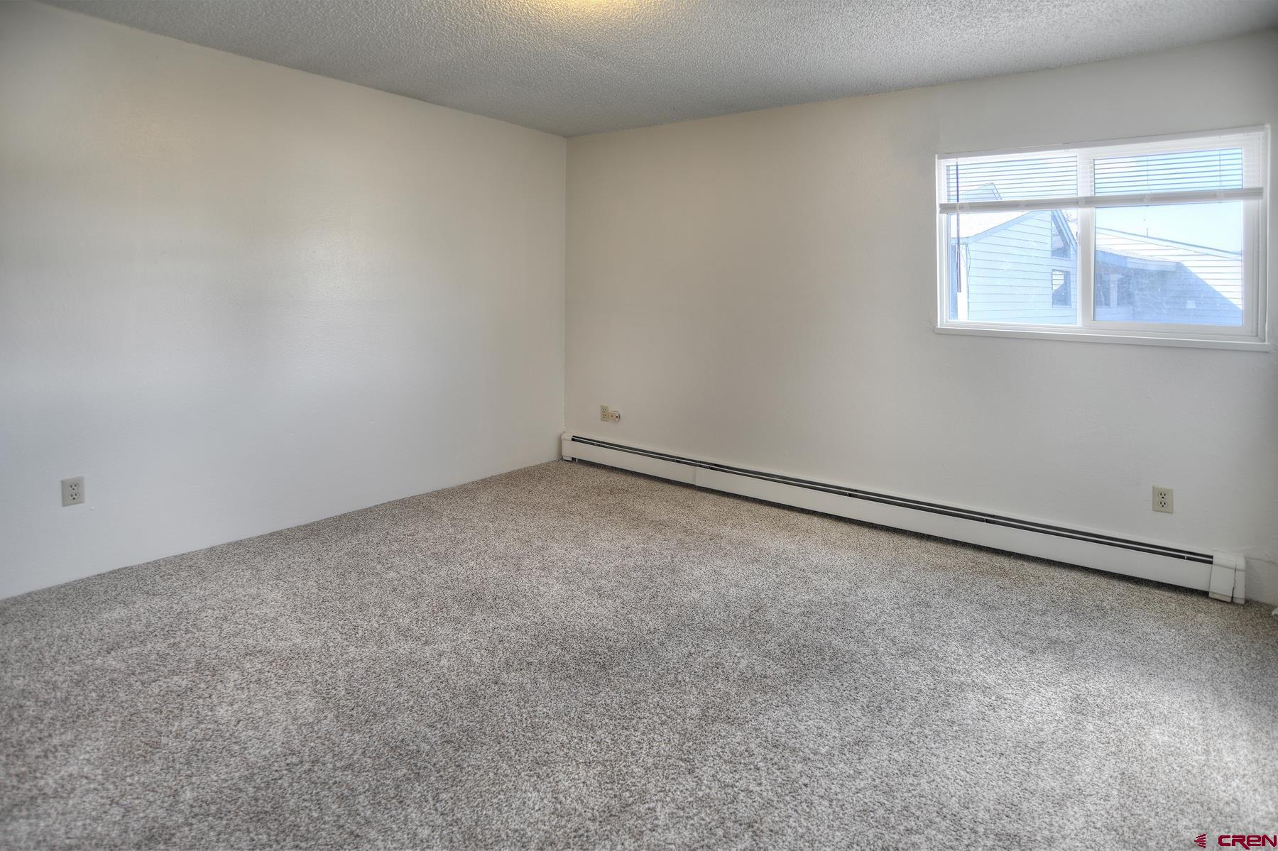 1135 Florida Road, Unit C27 Durango, CO 81301 - Photo 7 of 16 a view of an empty room with a window