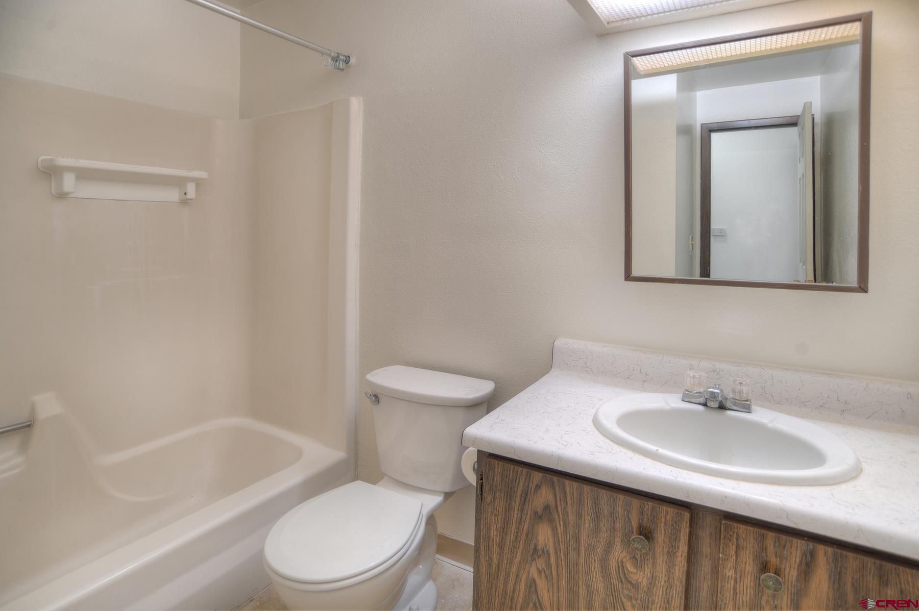 1135 Florida Road, Unit C27 Durango, CO 81301 - Photo 8 of 16 a bathroom with a sink toilet and shower