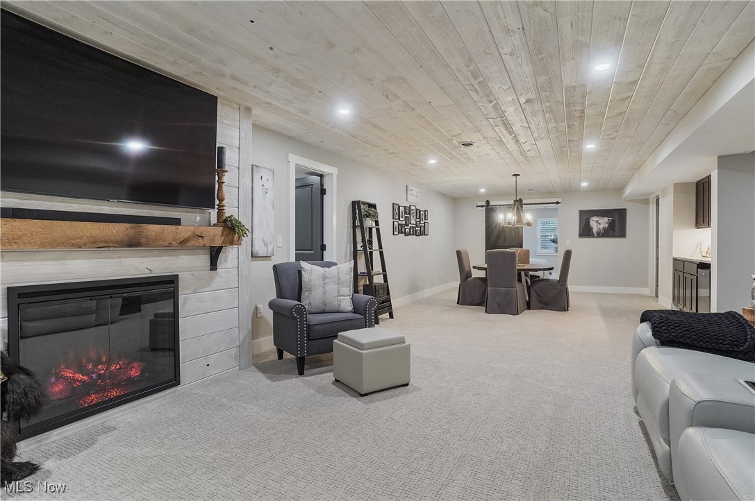 4437 Beach Road Medina, OH 44256 - Photo 33 of 50 Living room featuring wood ceiling, light colored carpet, and a fireplace