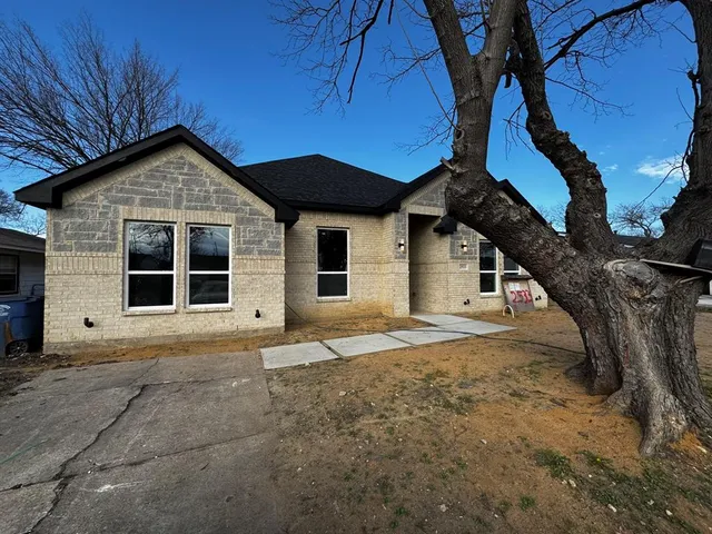 a house with trees in the background