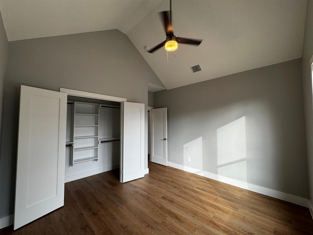 2533 Jonesboro Avenue Dallas, TX 75228 - Photo 20 of 27 an empty room with wooden floor and window