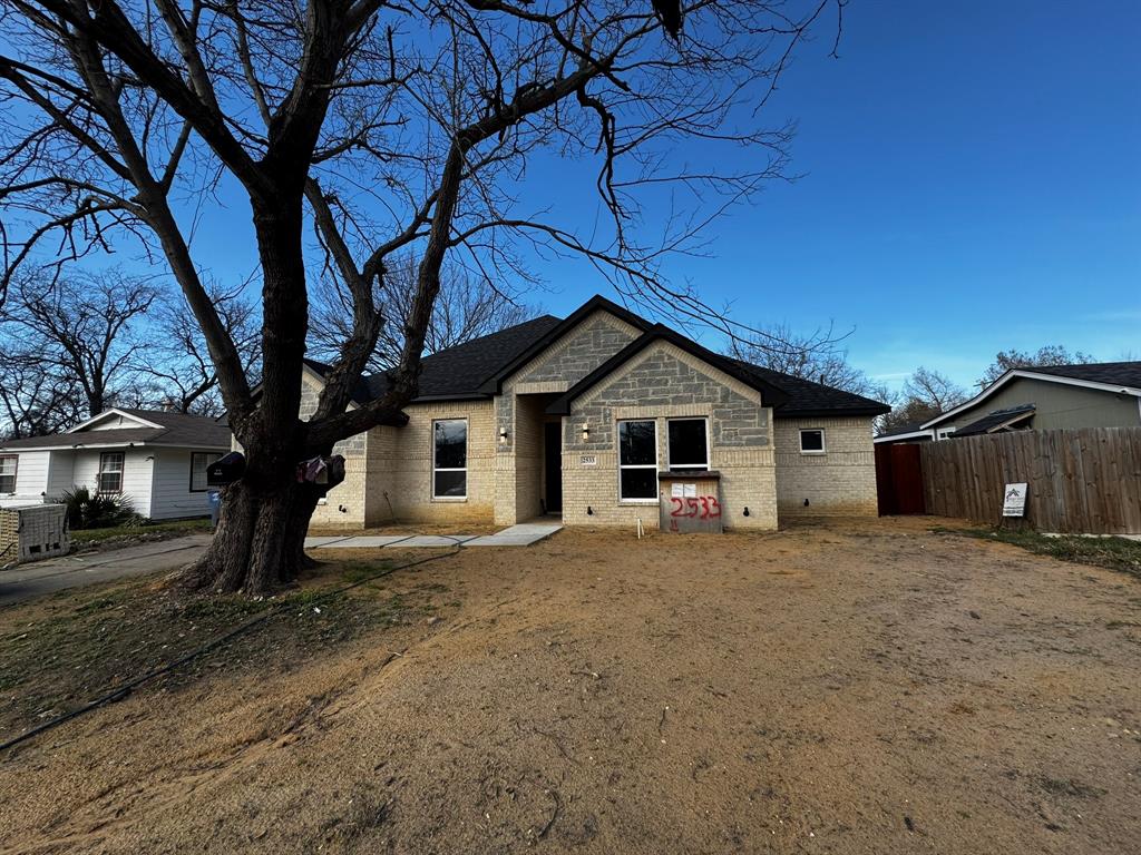 2533 Jonesboro Avenue Dallas, TX 75228 - Photo 2 of 27 a front view of a house with a yard